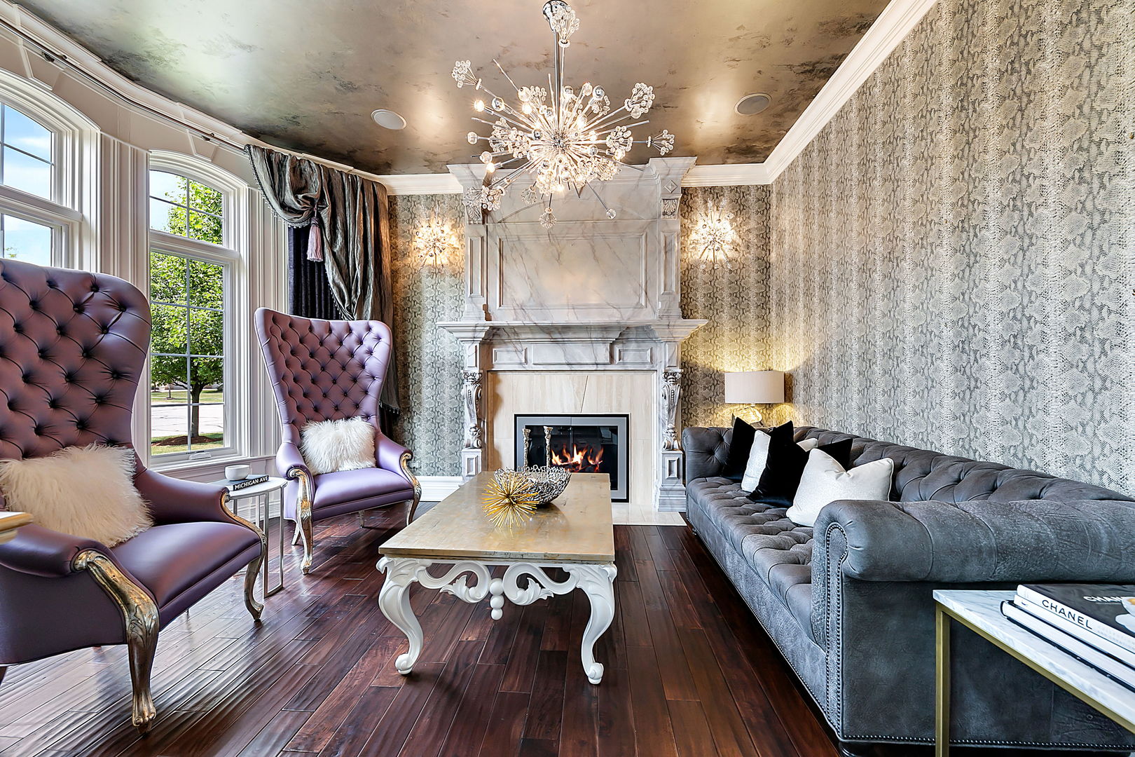 8611 Crest Court Burr Ridge, IL 60527 - Photo 18 of 58 a living room with furniture a chandelier and a fireplace