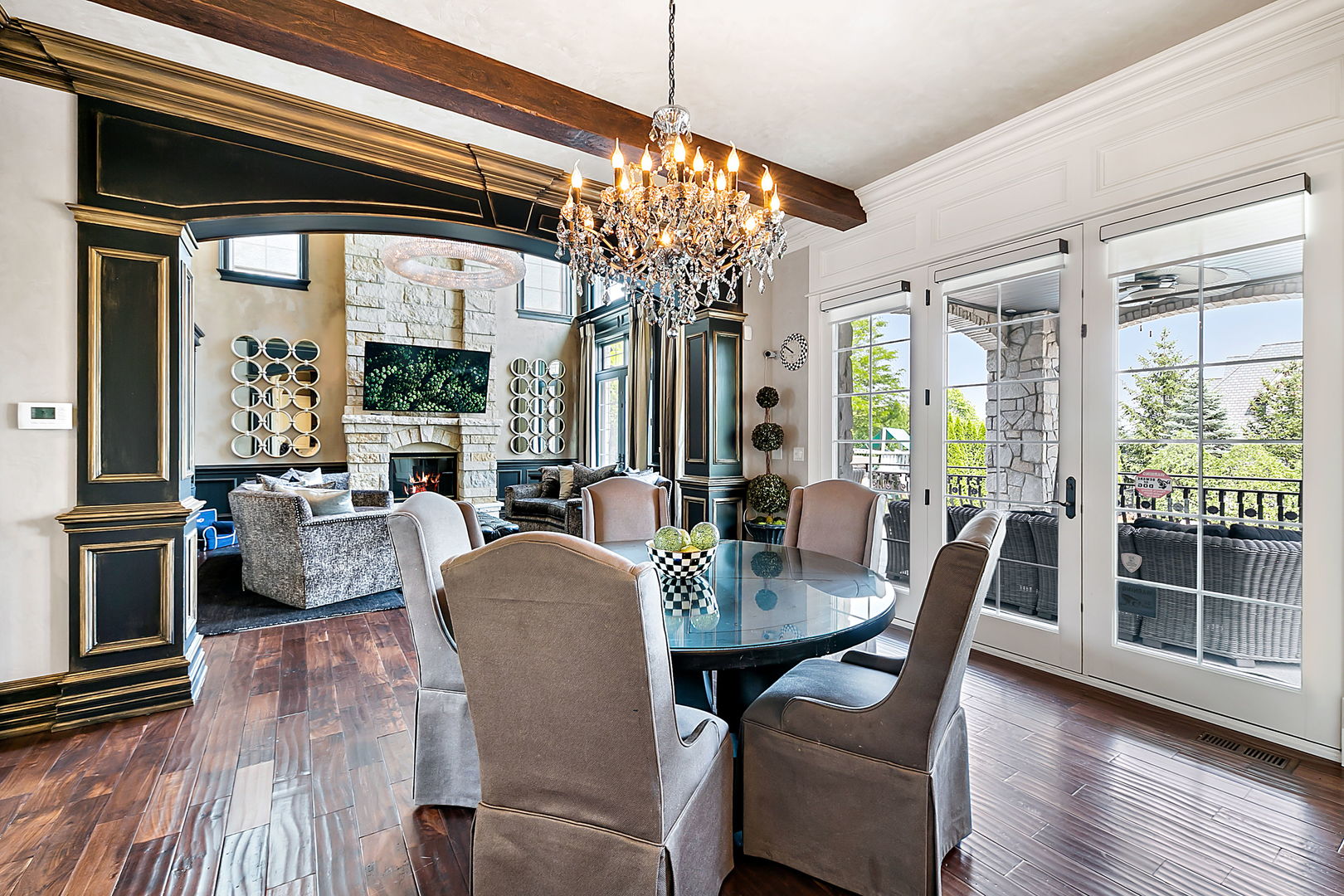 8611 Crest Court Burr Ridge, IL 60527 - Photo 19 of 58 a view of a dining room with furniture large windows and wooden floor