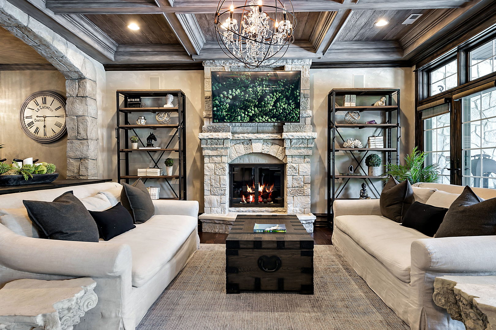8611 Crest Court Burr Ridge, IL 60527 - Photo 23 of 58 a living room with furniture a chandelier and a fireplace
