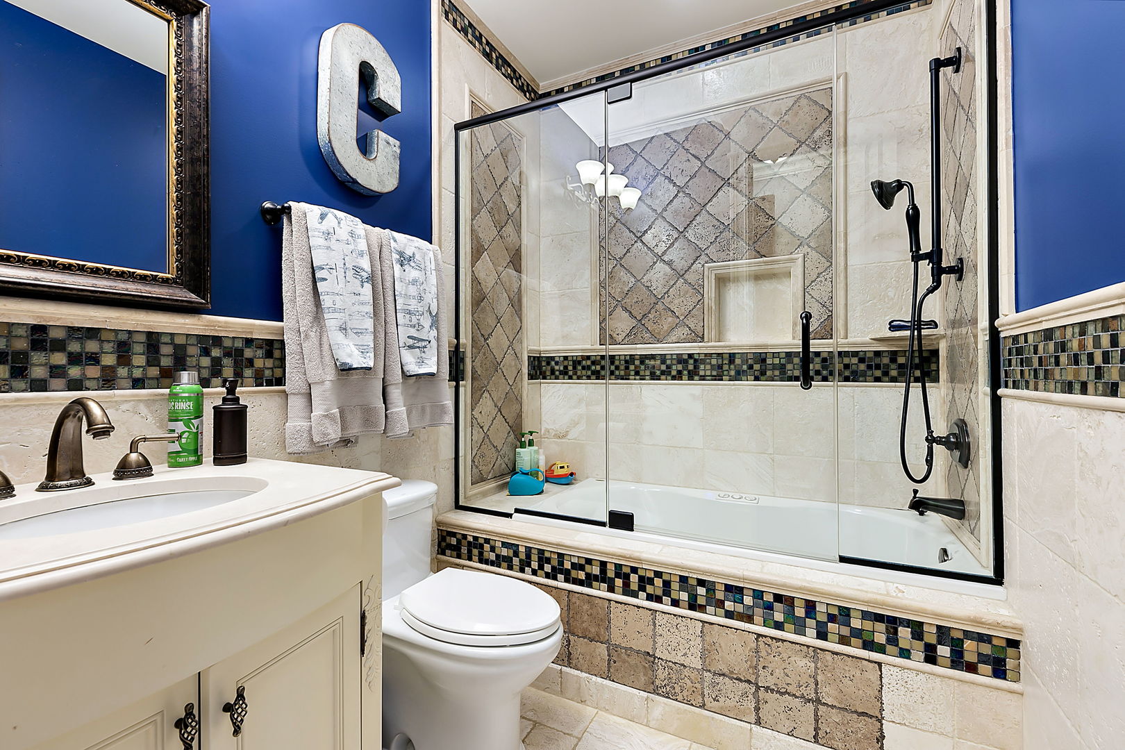 8611 Crest Court Burr Ridge, IL 60527 - Photo 36 of 58 a bathroom with a sink a mirror and a bathtub