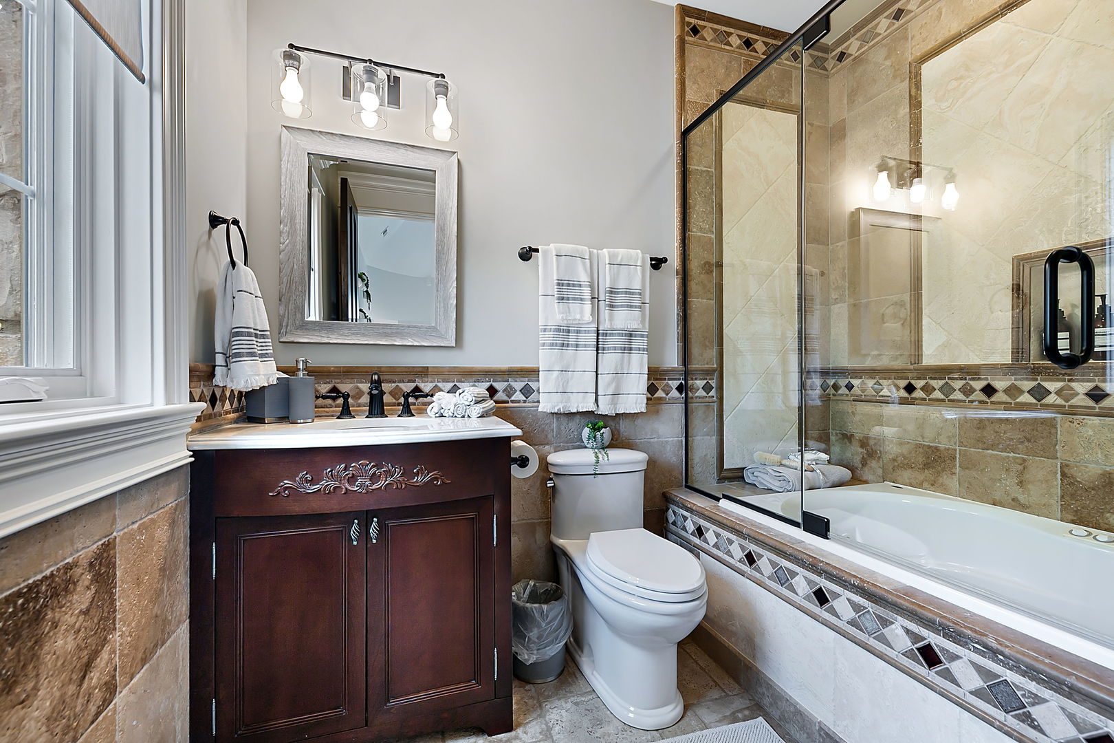 8611 Crest Court Burr Ridge, IL 60527 - Photo 41 of 58 a bathroom with a granite countertop toilet sink and mirror