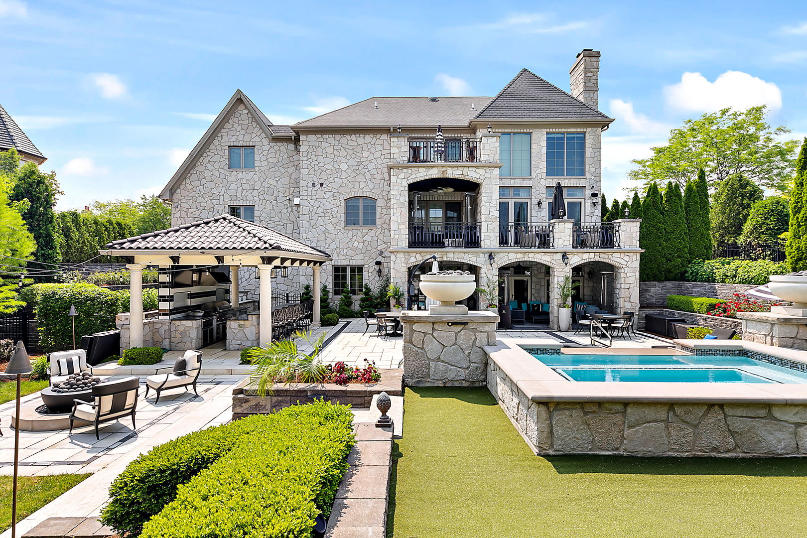 8611 Crest Court Burr Ridge, IL 60527 - Photo 6 of 58 a front view of a house with swimming pool having outdoor seating