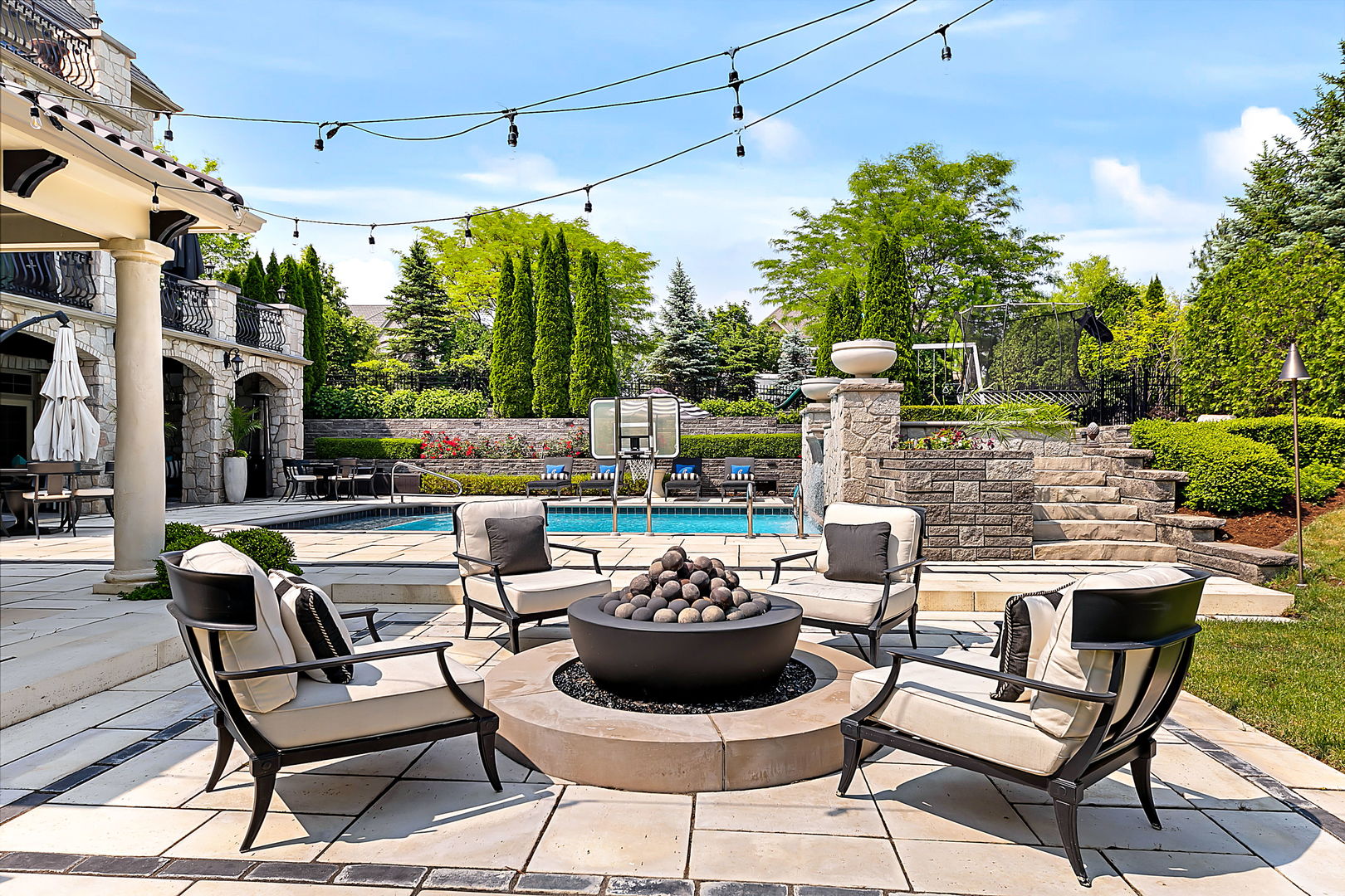 8611 Crest Court Burr Ridge, IL 60527 - Photo 8 of 58 a view of a patio with a dining table and chairs