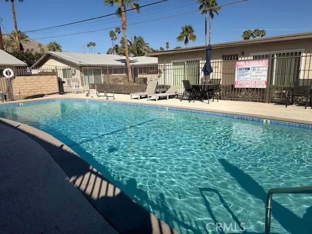 a view of a house with a backyard porch and sitting area