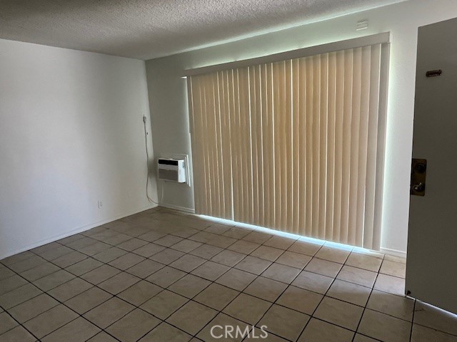 686 East Cottonwood Road, Unit 6 Palm Springs, CA 92262 - Photo 5 of 12 a view of a livingroom with an entryway