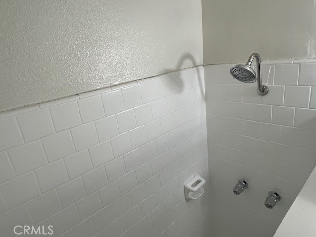 686 East Cottonwood Road, Unit 6 Palm Springs, CA 92262 - Photo 8 of 12 a bathroom with a shower
