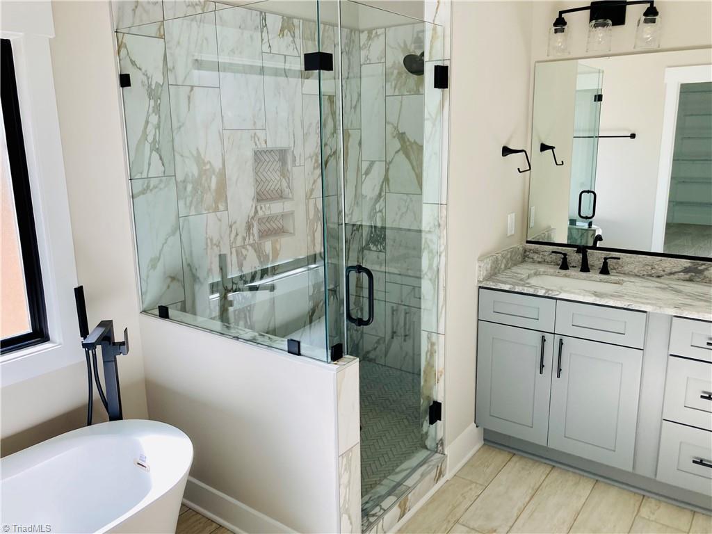 6209 Phillippi Road Julian, NC 27283 - Photo 17 of 19 This picture is an example of a previous new construction from the same house plan: Houseplans.com plan 430-245