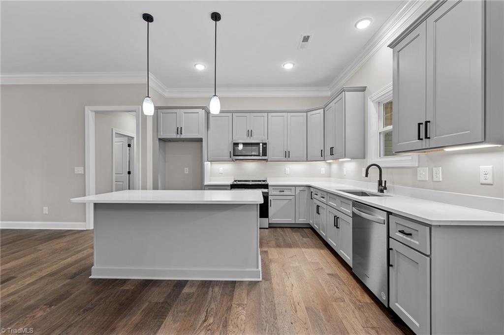 6209 Phillippi Road Julian, NC 27283 - Photo 6 of 19 Please note, this Photo is from a recent property built in the neighborhood representation and not an actual photo of the listed home. Fit and finish will be similar.This picture is an example of a previous new construction from the same house plan: Houseplans.com plan 430-245