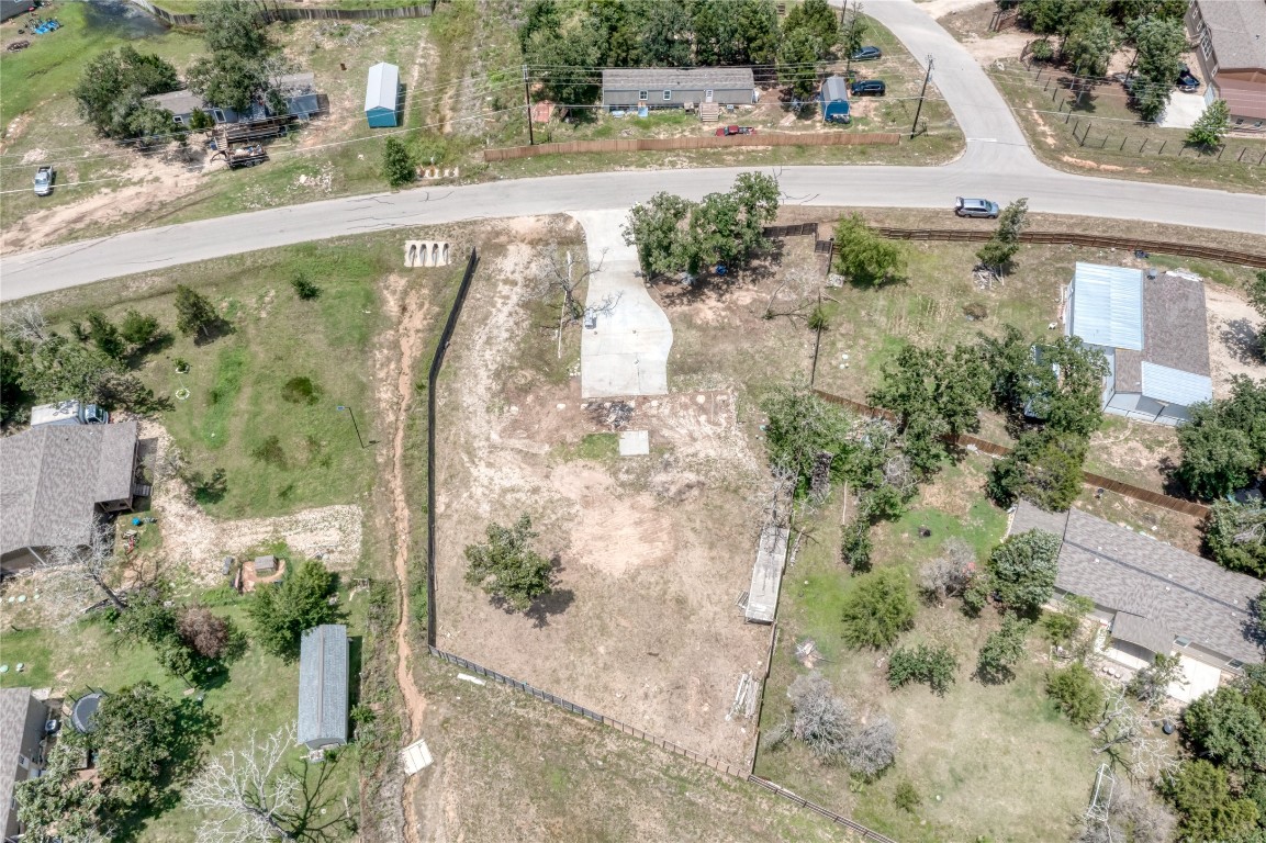 133 Wisteria Way Elgin, TX 78621 - Photo 16 of 18 an aerial view of a house with a yard and mountain view