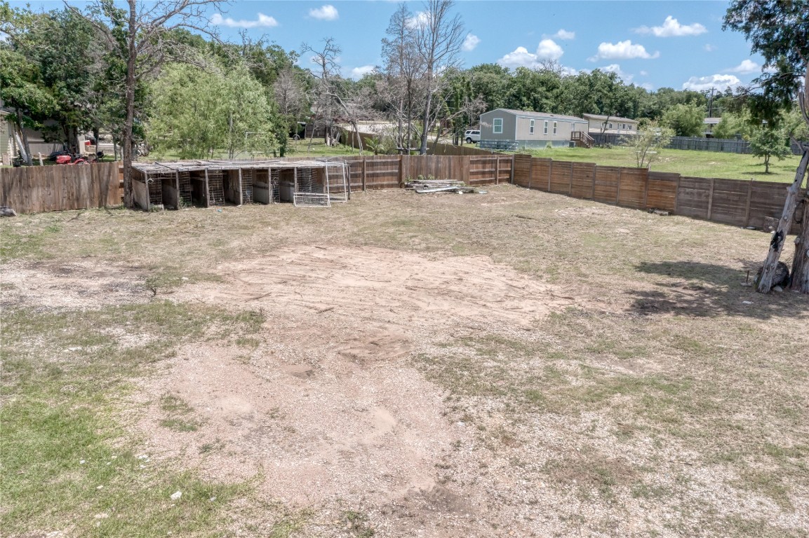 133 Wisteria Way Elgin, TX 78621 - Photo 2 of 18 a view of a lake with houses