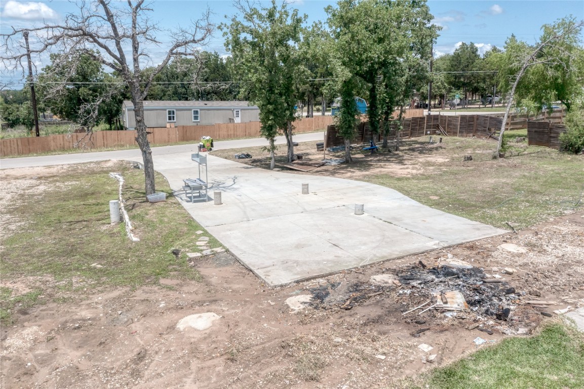 133 Wisteria Way Elgin, TX 78621 - Photo 3 of 18 a view of a swimming pool with a patio