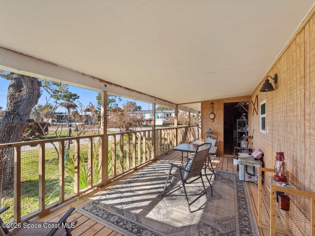 7380 129th Place Sebastian, FL 32958 - Photo 11 of 32 a living room with furniture and a floor to ceiling window