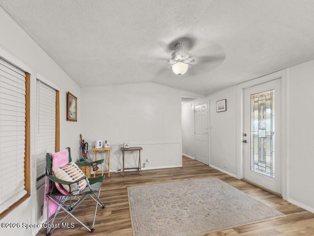7380 129th Place Sebastian, FL 32958 - Photo 18 of 32 a living room with furniture and a ceiling fan