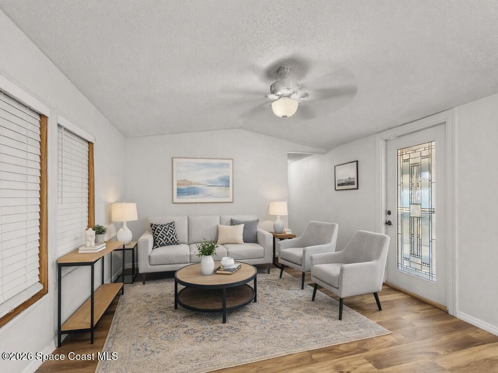7380 129th Place Sebastian, FL 32958 - Photo 19 of 32 a living room with furniture potted plant and a window