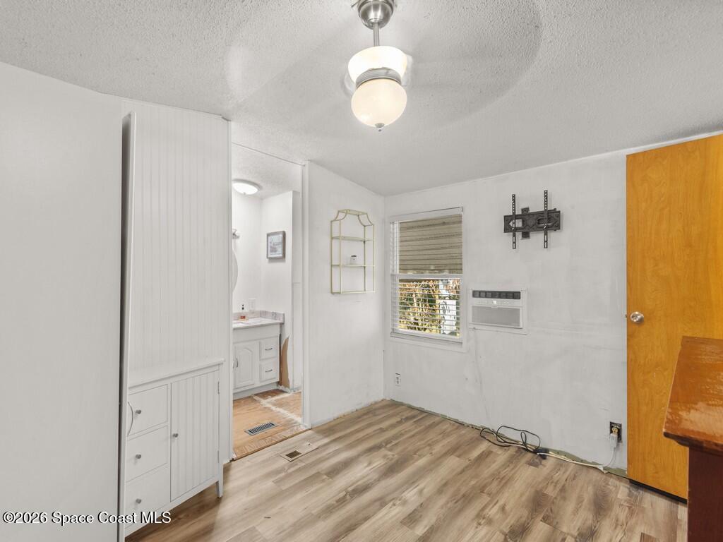 7380 129th Place Sebastian, FL 32958 - Photo 23 of 32 a view of empty room with wooden floor