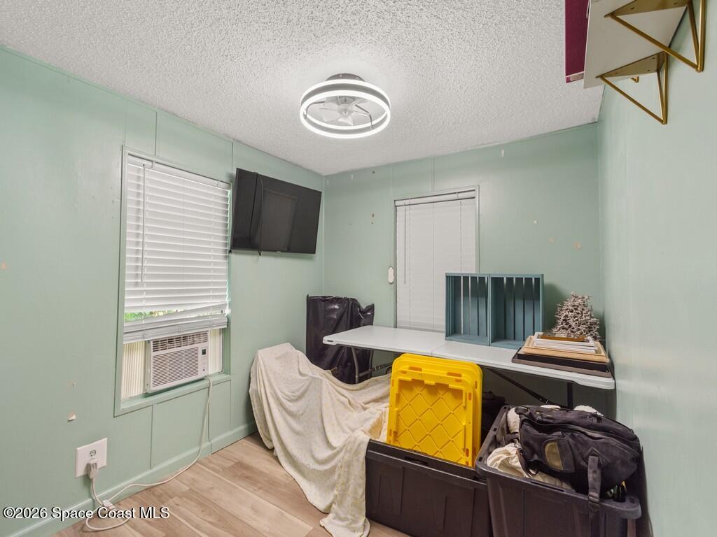 7380 129th Place Sebastian, FL 32958 - Photo 27 of 32 a living room with furniture and a flat screen tv
