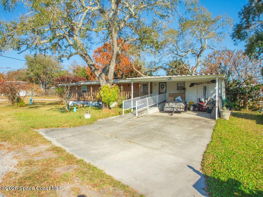7380 129th Place Sebastian, FL 32958 - Photo 7 of 32 a view of a swimming pool with a patio
