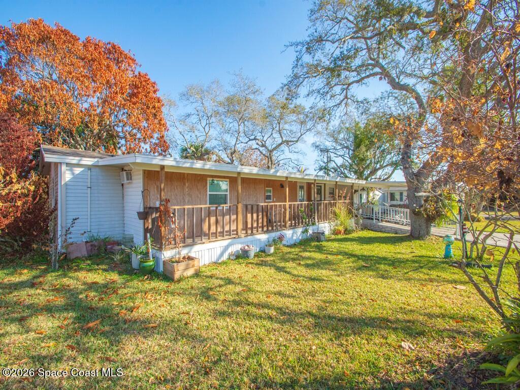 7380 129th Place Sebastian, FL 32958 - Photo 9 of 32 a view of a house with backyard and sitting area
