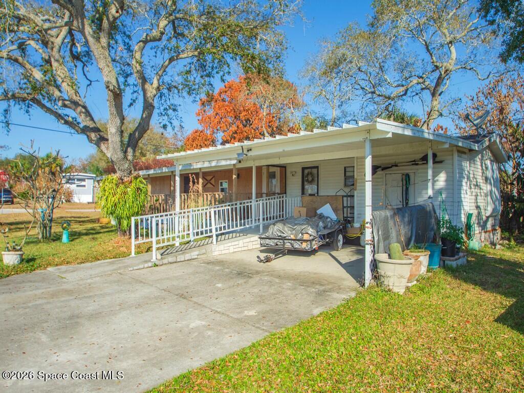 7380 129th Place Sebastian, FL 32958 - Photo 10 of 32 a view of a house with backyard porch and sitting area
