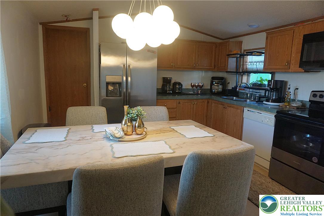 3113 Newburg Road Nazareth, PA 18064 - Photo 6 of 18 a kitchen with a table and chairs in it