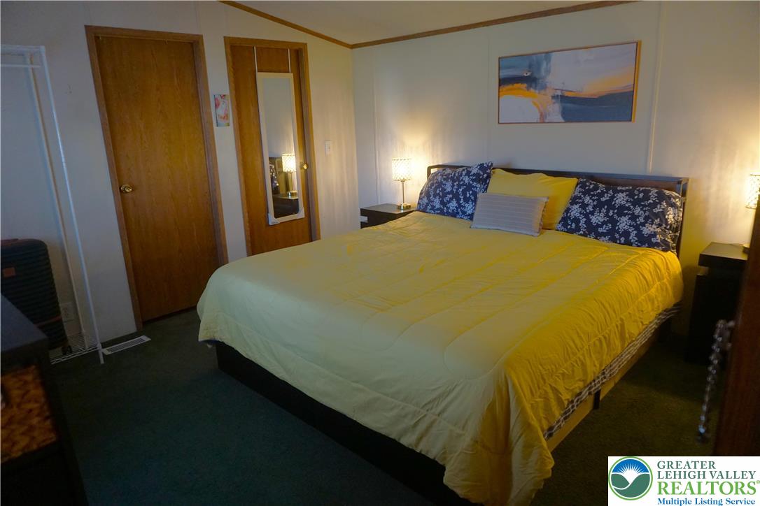 3113 Newburg Road Nazareth, PA 18064 - Photo 9 of 18 a bed sitting in a bedroom next to a window