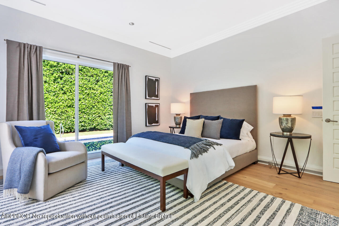 215 Indian Road Palm Beach, FL 33480 - Photo 18 of 31 a spacious bedroom with a bed couch and a window