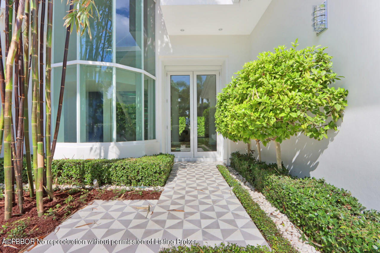 215 Indian Road Palm Beach, FL 33480 - Photo 2 of 31 a view of a garden with pathway