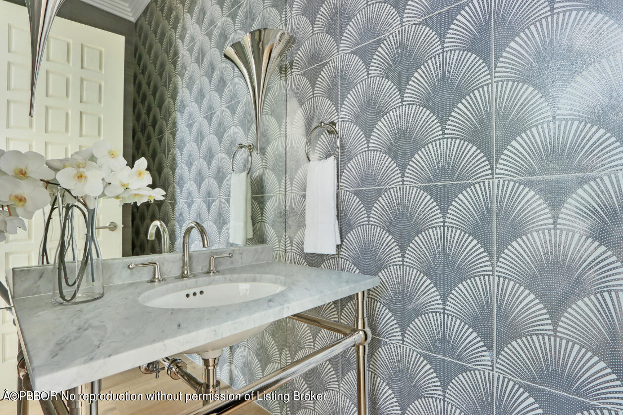 215 Indian Road Palm Beach, FL 33480 - Photo 24 of 31 a bathroom with a sink and mirror