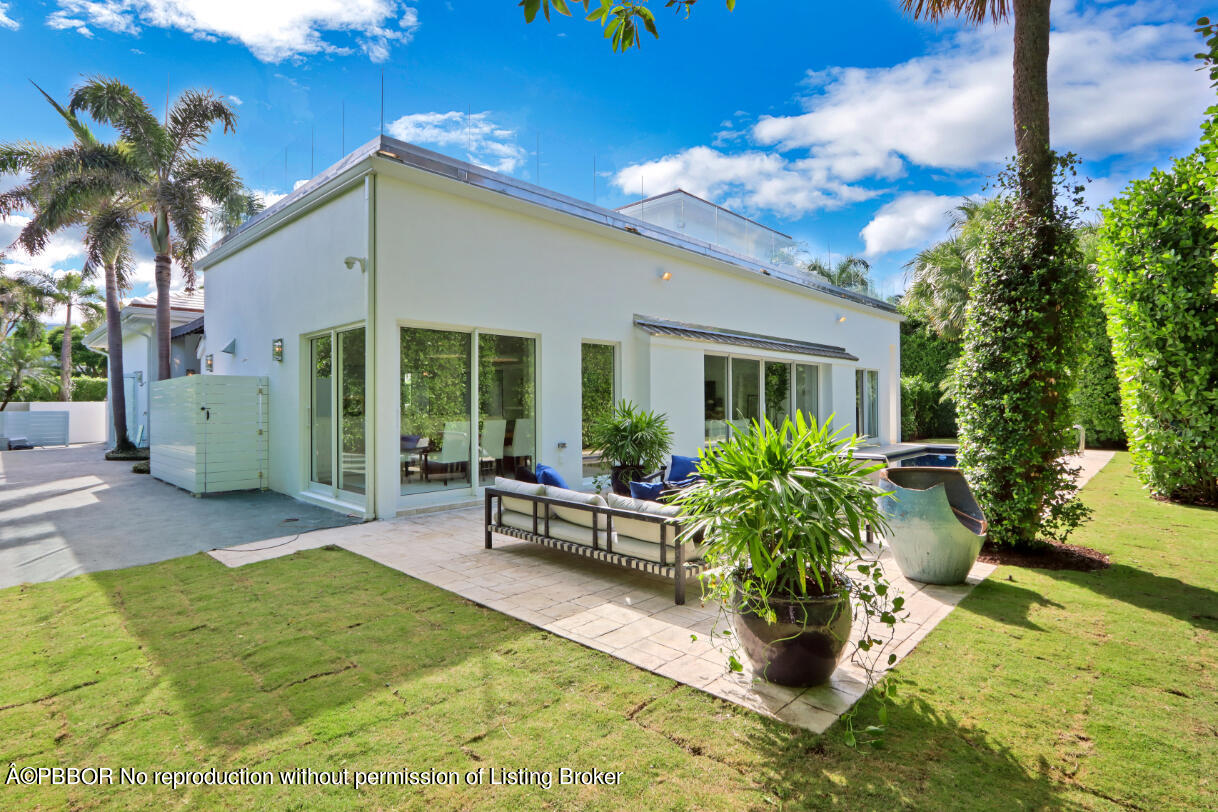 215 Indian Road Palm Beach, FL 33480 - Photo 28 of 31 a view of a house with backyard porch and sitting area