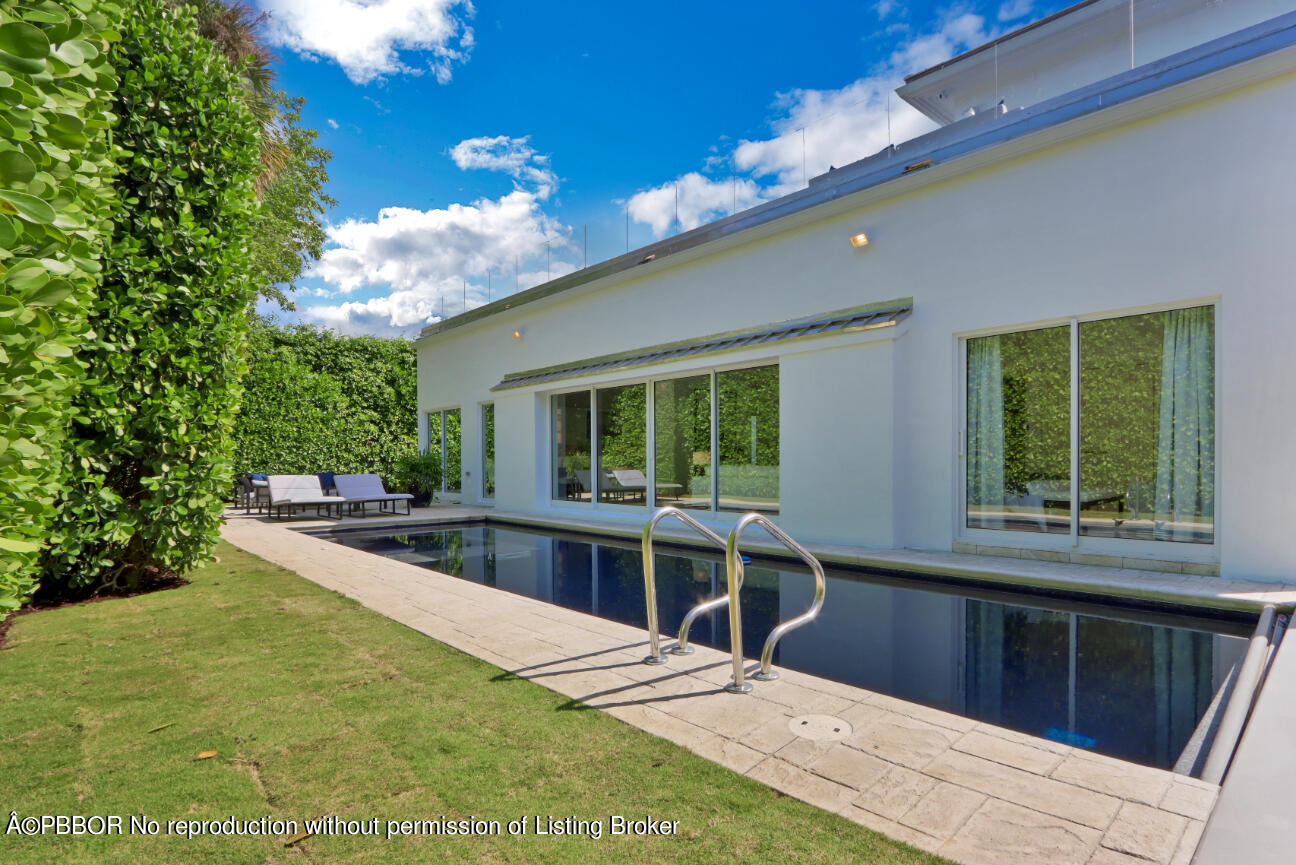 215 Indian Road Palm Beach, FL 33480 - Photo 31 of 31 a view of a kitchen with kitchen island and a large window