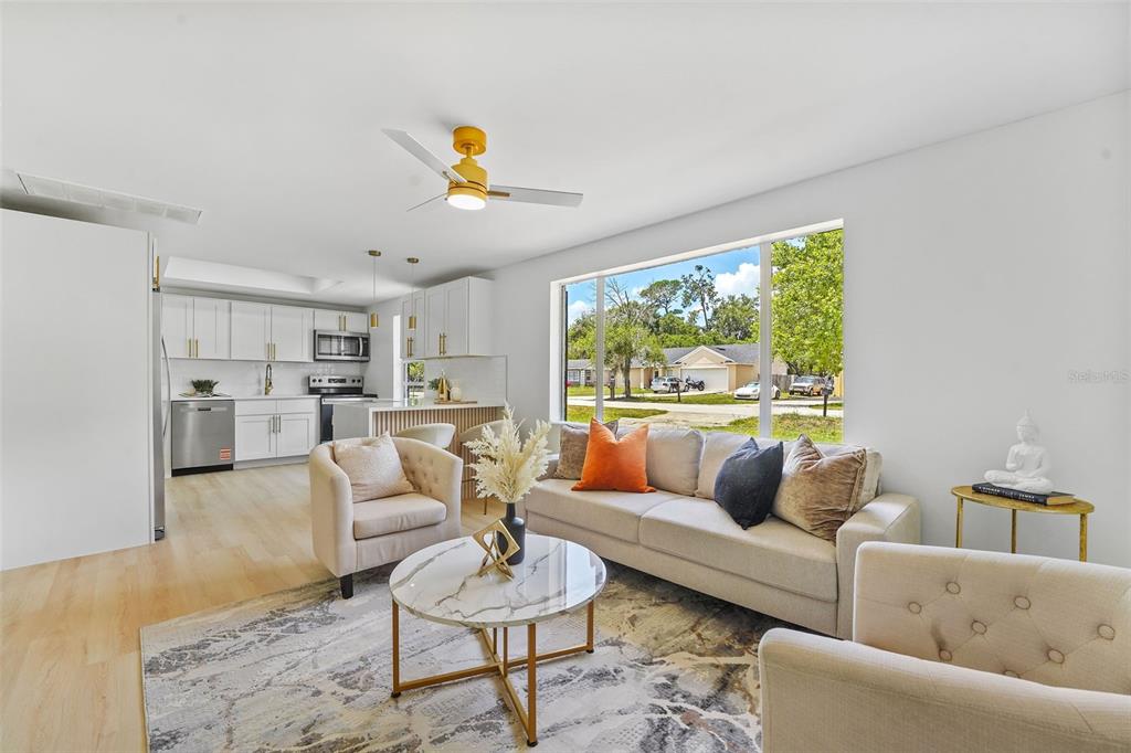 17 Palmira Road DeBary, FL 32713 - Photo 8 of 28 a living room with furniture and a large window
