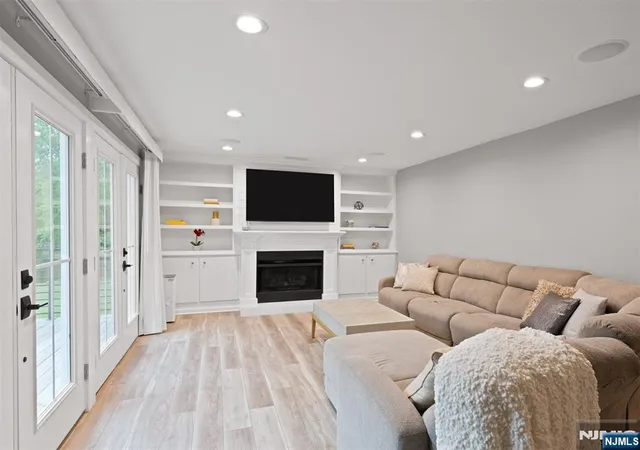 a living room with furniture fireplace and flat screen tv