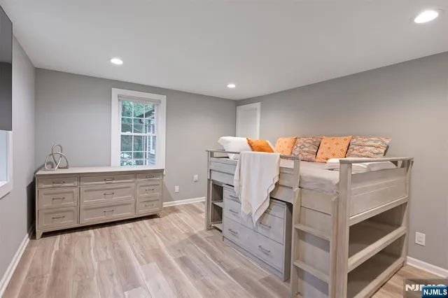 a bed room with a bed and a window