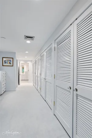 a big room with closet and windows