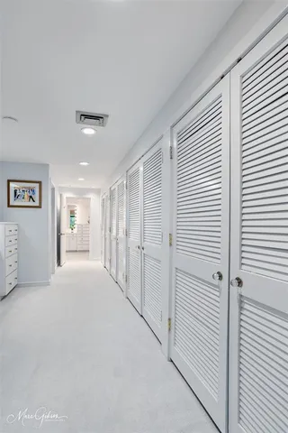 a big room with closet and windows