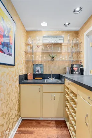 a kitchen with stainless steel appliances granite countertop a sink and cabinets