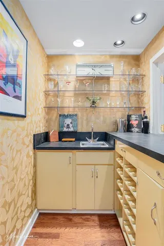 a kitchen with stainless steel appliances granite countertop a sink and cabinets