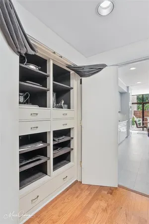 a view of walk in closet with empty racks