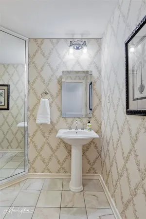 a bathroom with a sink and mirror