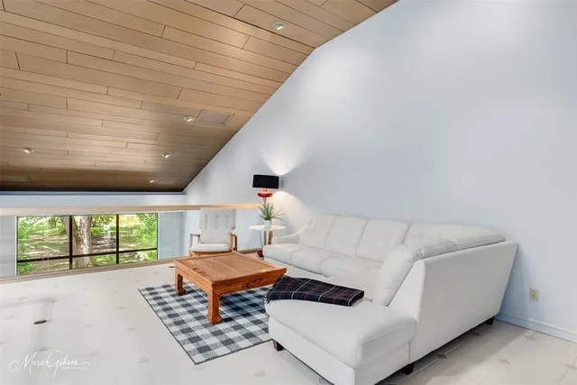 a living room with furniture and a rug