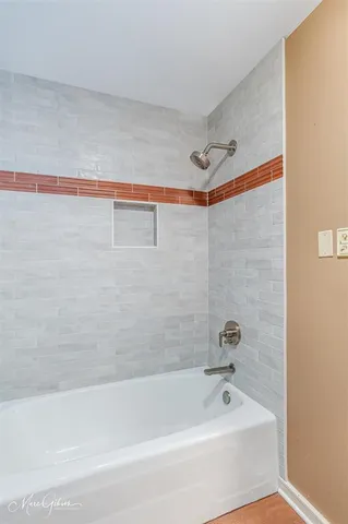 a bathroom with a shower and a bathtub