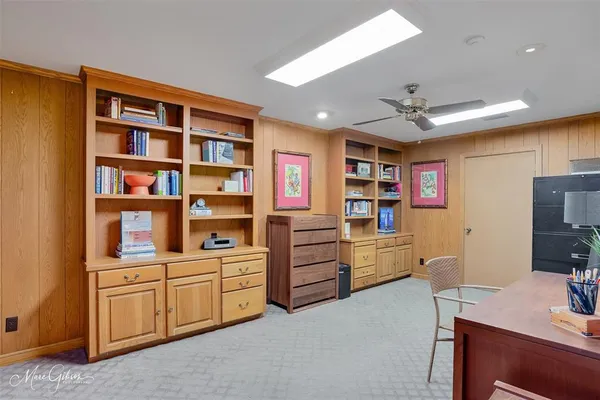 a view of workspace with furniture and cabinet