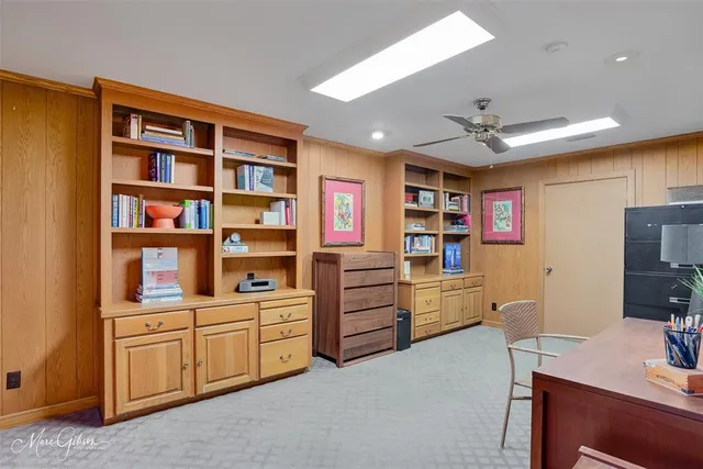 a view of workspace with furniture and cabinet