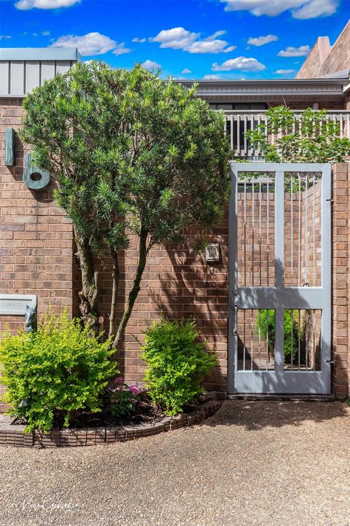 300 Pierremont Road, Unit 18 Shreveport, LA 71106 - Photo 37 of 40 a front view of a building with a garden