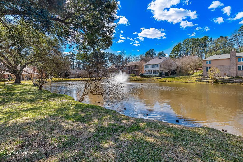 300 Pierremont Road, Unit 18 Shreveport, LA 71106 - Photo 38 of 40 a view of a lake with a house in the background
