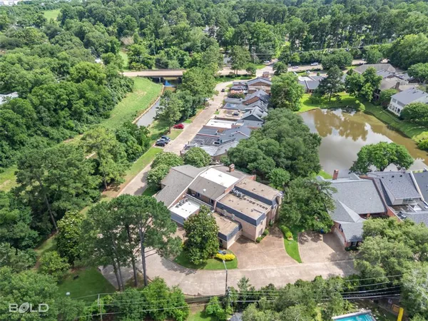 an aerial view of house with yard