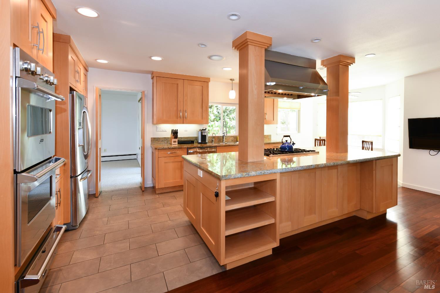 22 Monez Boulevard Napa, CA 94559 - Photo 11 of 30 a kitchen with stainless steel appliances granite countertop a stove a sink and a refrigerator