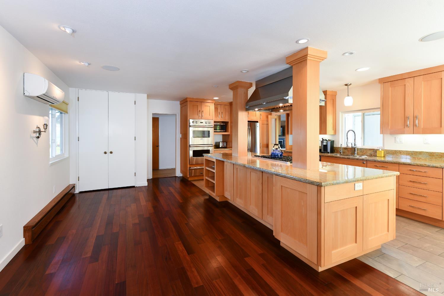 22 Monez Boulevard Napa, CA 94559 - Photo 12 of 30 a large kitchen with stainless steel appliances a large counter top and a wooden floors