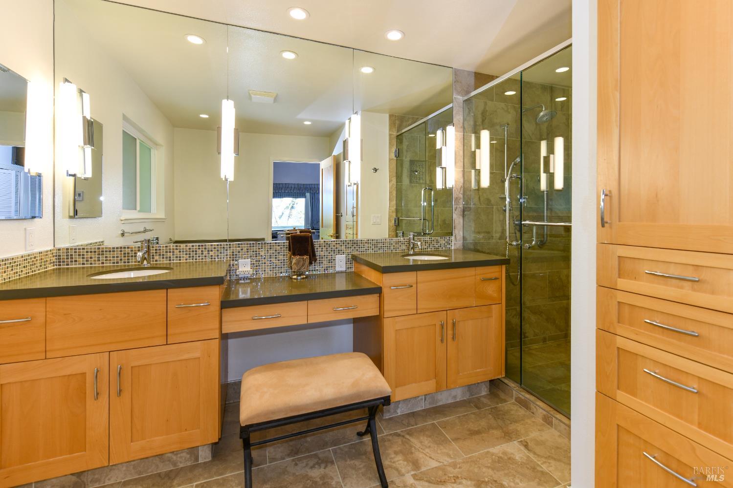 22 Monez Boulevard Napa, CA 94559 - Photo 17 of 30 a bathroom with a sink mirror and a shower