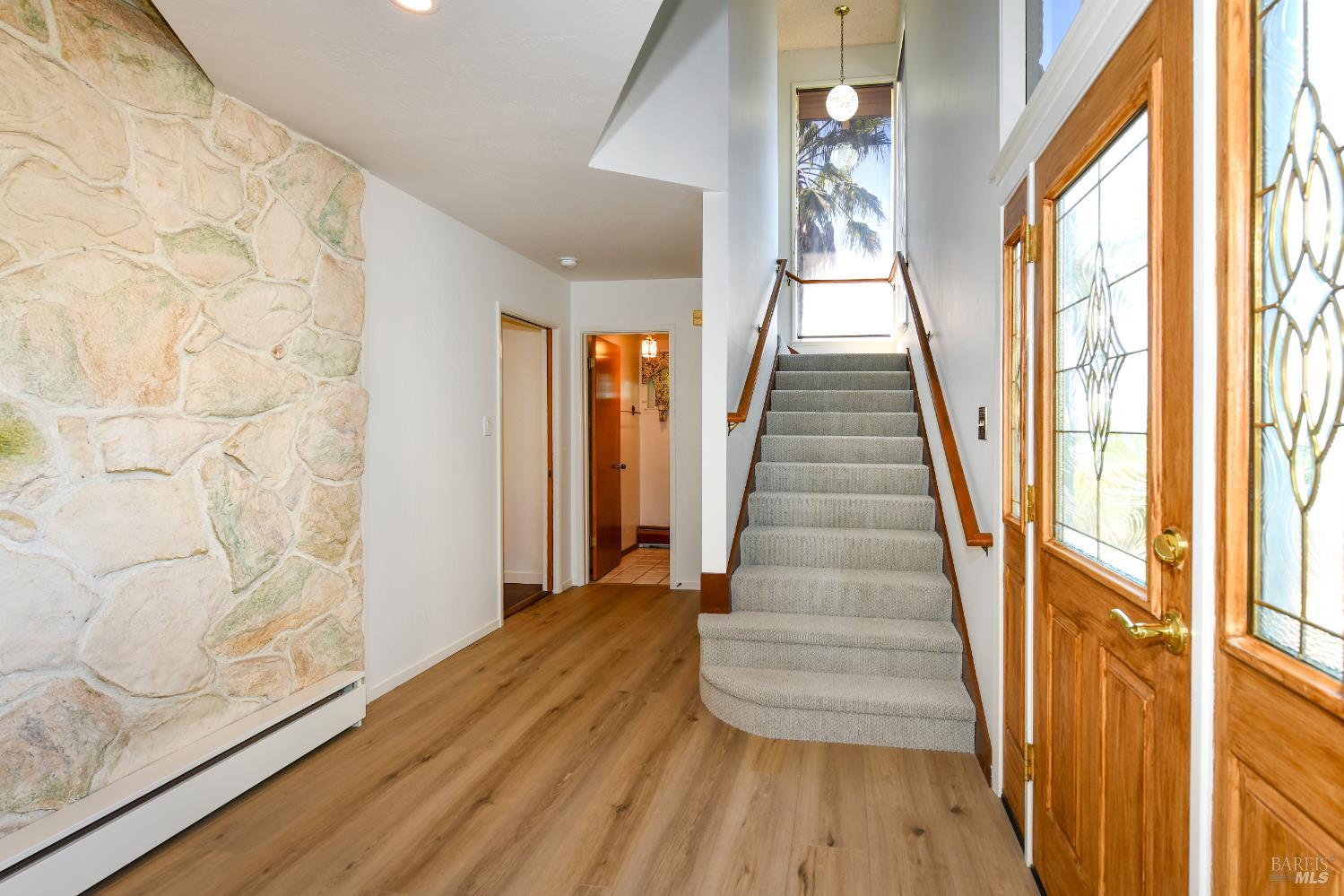 22 Monez Boulevard Napa, CA 94559 - Photo 4 of 30 a view of entryway with wooden floor and stairs